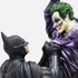 Batman holding the Joker Batman: Arkham Origins Collector’s Edition